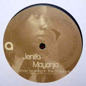 JENIFA MAYANJA - Woman Walking In The Shadows